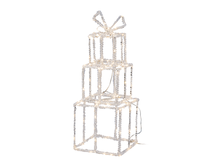 Illuminated stacked gift boxes with a bow, perfect for festive decoration.