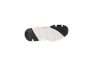 Pink and white sports shoe sole with black details.