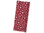 Red Christmas wrapping paper with white snowflakes.
