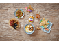 Honey, yogurt with nuts, figs, sesame cookies, and dried fruit on wood.