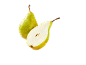 Two fresh green pears, one whole and one cut in half, with visible seeds.