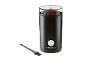 Black electric coffee grinder with a transparent lid full of ground coffee and a cleaning brush.