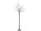 LED light tree with black branches and small warm white lights on a black background.
