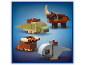 Four small dinosaur figures built from colorful toy blocks.