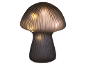Decorative mushroom-shaped table lamp with ribbed glass and warm light.