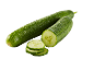 Fresh whole and sliced cucumbers on a black background.
