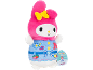 Pink plush toy with bunny ears, yellow bows, and blue clothing with prints.