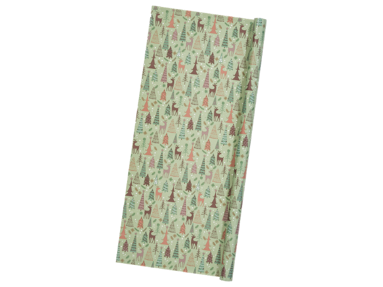 Christmas wrapping paper with trees and deer in pastel tones.