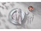 Cutlery and plates on a grey table with shadows and a bowl of salt.