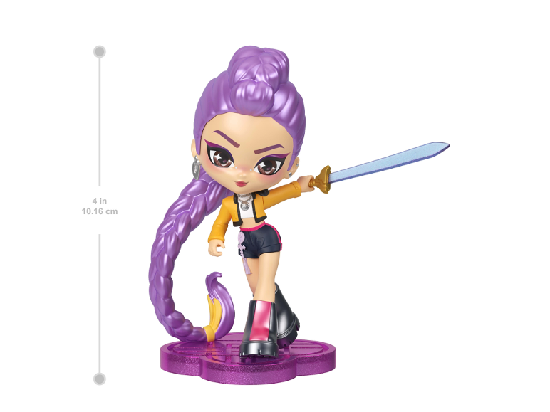 A 4-inch purple-haired doll with a sword, standing on a glittery base.