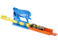 Toy car launcher with a black and yellow race car on an orange track.