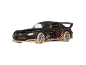 Black sports toy car with orange and gold patterns, beige rims, and a spoiler.
