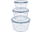 Stack of three round glass food storage containers with blue-rimmed lids