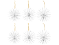 Six white snowflake-shaped Christmas decorations on a black background