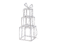 Illuminated Christmas decoration in the shape of three stacked gifts.
