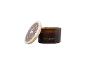 Toasted Chestnut scented candle in a brown glass with a decorated lid featuring a deer motif