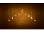 Warm golden star-shaped string lights creating an arch on a dark background.