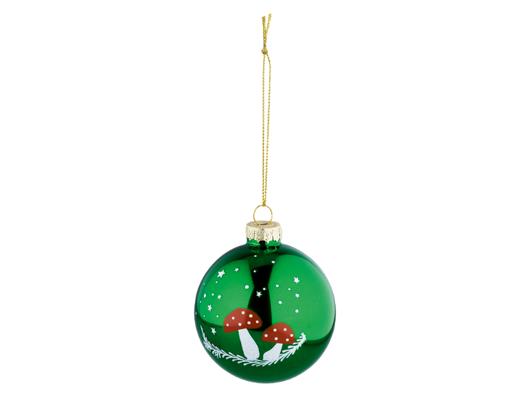 Green Christmas bauble with white mushrooms and stars, hanging from a gold cord.