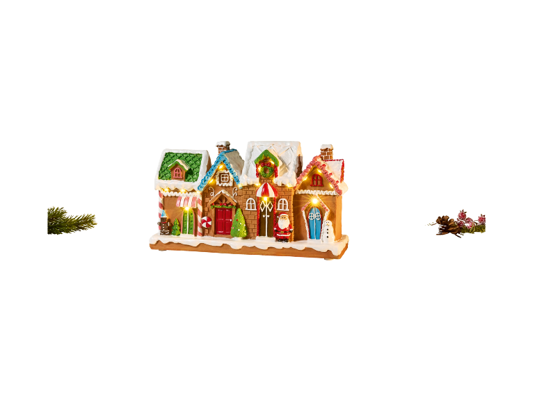 Illuminated gingerbread house with Christmas decorations