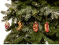 Christmas ornaments shaped like popcorn, croissant, pretzel, and hot dog on a Christmas tree.