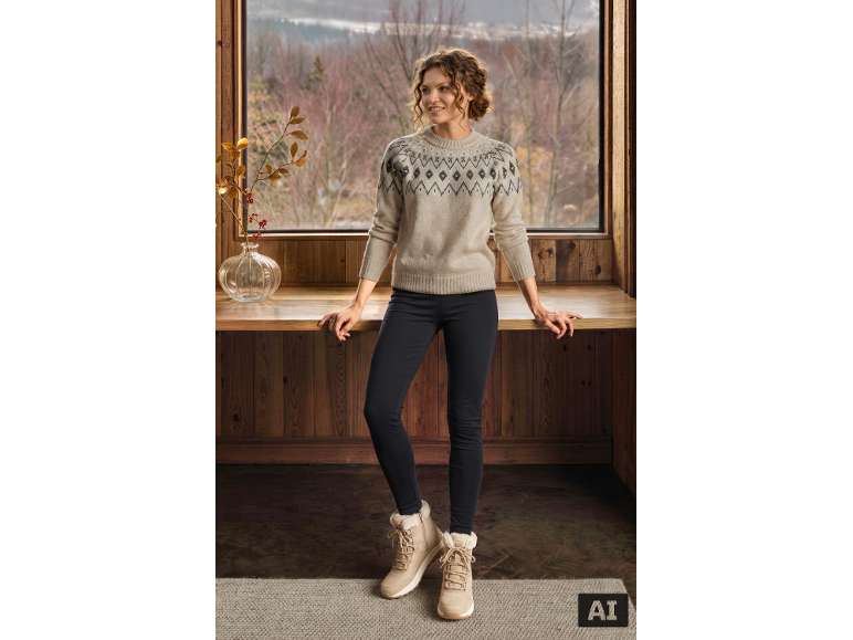 Woman in patterned beige sweater, black leggings, and light winter boots in a cozy setting.