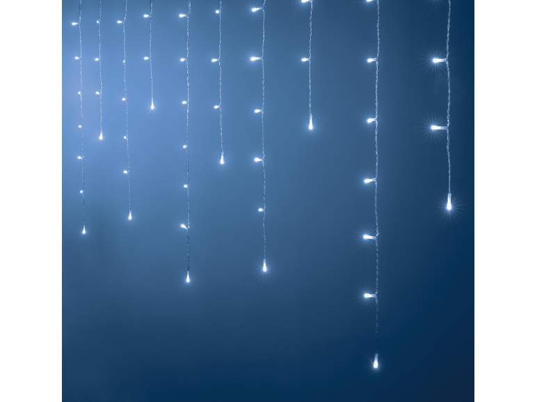 Curtain of white LED lights hanging against a dark blue background.