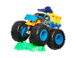 Blue and yellow monster truck toy crushing a green car toy.