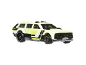 White toy car with yellow and black accents, featuring 'XXX HWGRFX' text.