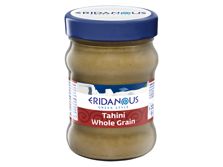 A jar of Greek style whole grain tahini with a blue lid.