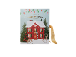 Scented candle advent calendar in the shape of a festive house with a ribbon