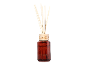 Fireside reed diffuser in a brown glass bottle with a wooden cap