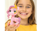 A child holding a pink toy pony with wings.