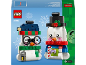 Toy building set featuring two snowmen in a winter theme with accessories.