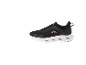 Black sports shoes with pink details and a white sole with cut-outs.
