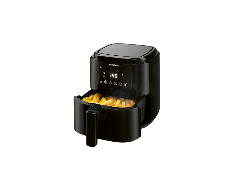 Black air fryer with a basket of golden french fries, displaying 180°C.