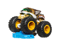 Tiger-shaped toy monster truck with large wheels, standing on a blue obstacle.