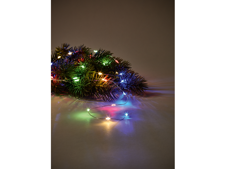 Christmas garland with colorful lights on a dark background.