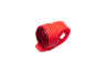 Red silicone bicycle taillight on a black background.