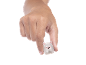 Hand holding a small white plush toy with pink ears and an animal face.