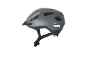Grey bicycle helmet with a visor and a red rear light.