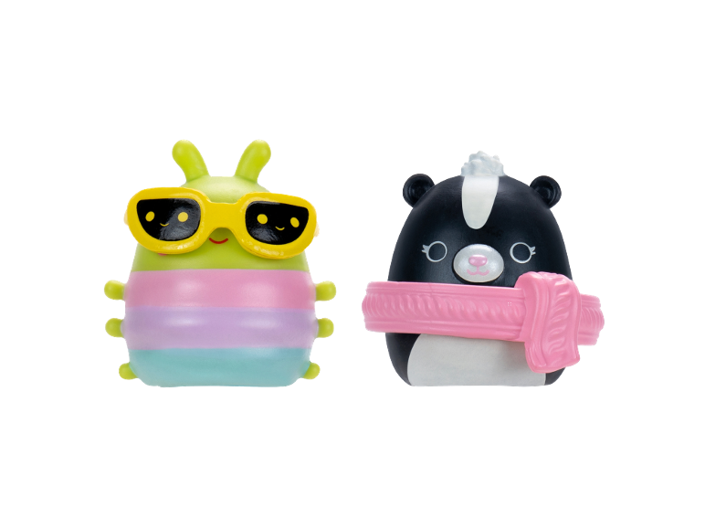 Two soft toys: a green caterpillar with sunglasses and a black and white skunk with a scarf.