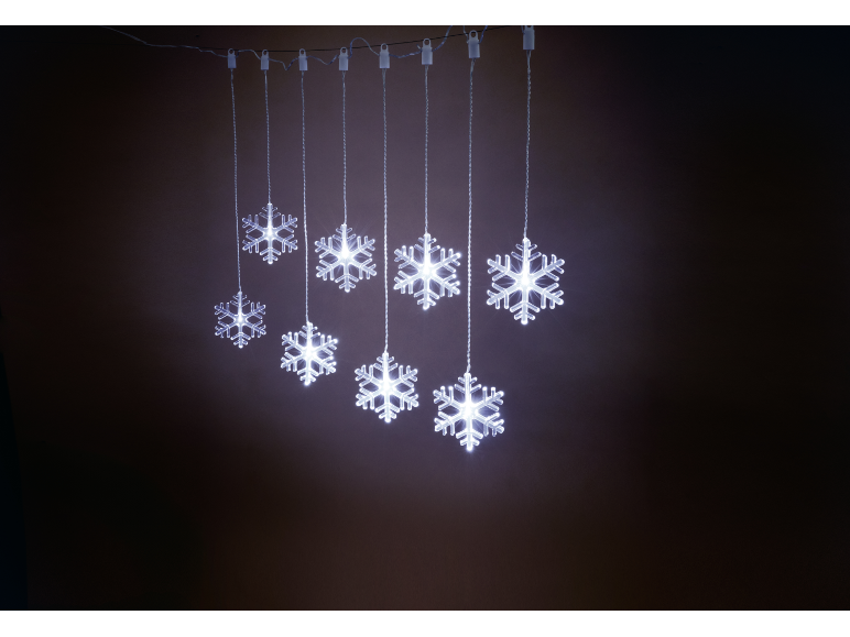 Christmas light decoration with hanging illuminated snowflakes