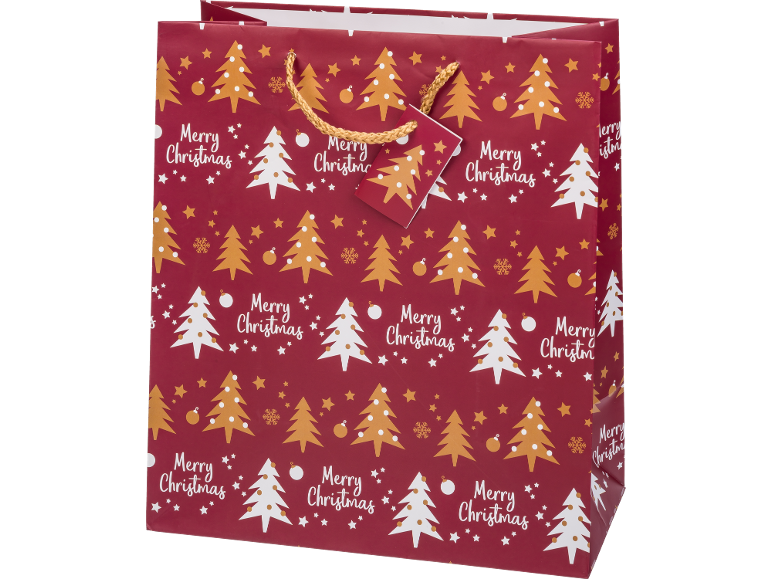 Red Christmas gift bag with gold and white Christmas trees and 'Merry Christmas' text.