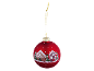 Red Christmas bauble with gingerbread houses and snowy Christmas trees.