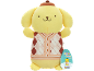 Yellow plush toy with a brown hat and an argyle sweater, with a hanging tag.