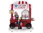 Christmas decoration featuring a candy cart, 'COTTON CANDY' sign, and figures.
