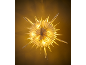 Illuminated white paper star hanging lamp against a warm background