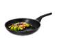 Salmon and vegetables in a black frying pan on a black background.