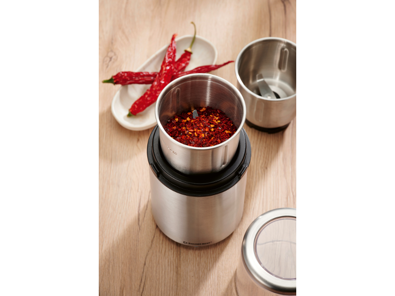 Spice grinders with dried chilies and chili flakes.