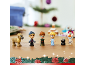 Toy figures of movie characters with a reindeer, Kristoff, Anna, Elsa, a penguin, and Olaf, with Christmas decorations.
